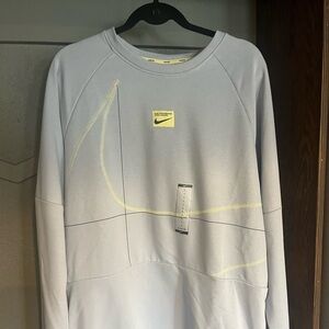 Nike Men’s Blue Whisper Crewneck Sweatshirt with Yellow Logo Detail